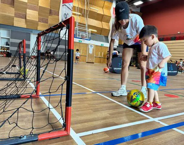 Toddlers exploring soccer sports through play