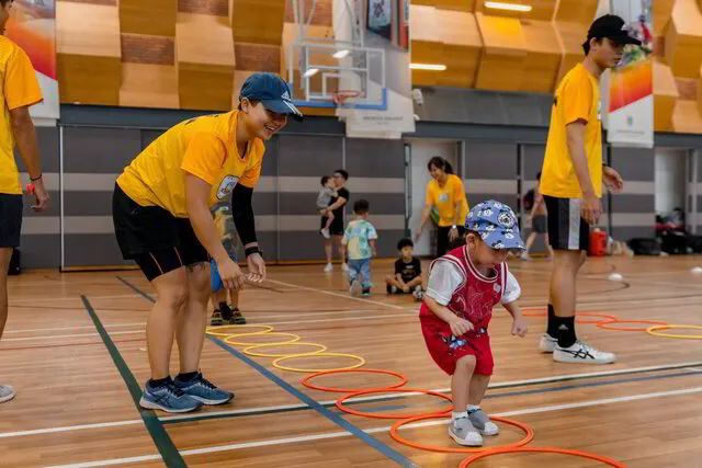 Little Toddler learning how to hop - Sports Class for Kids