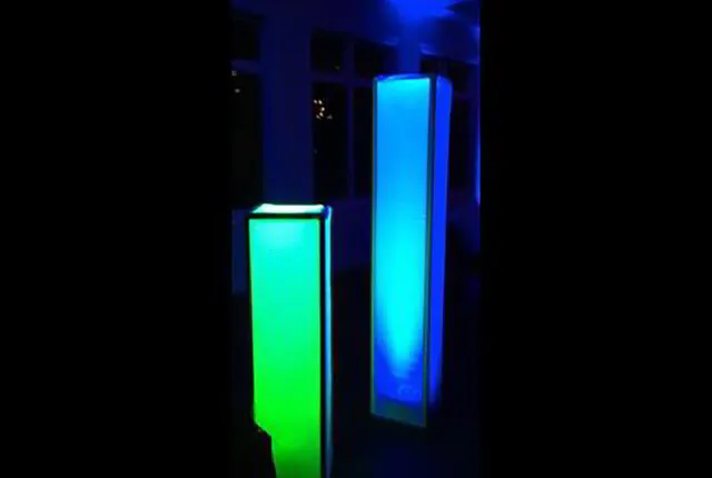 two pillars glowing blue and green