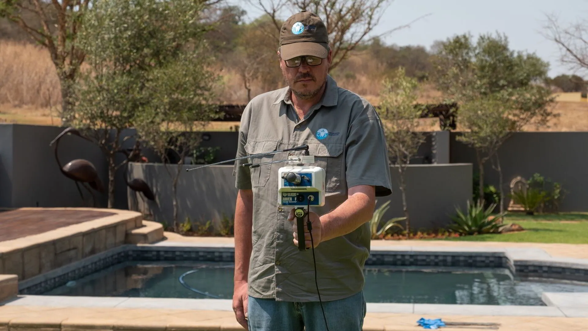 GWS- Man with River F Plus water detector device in action