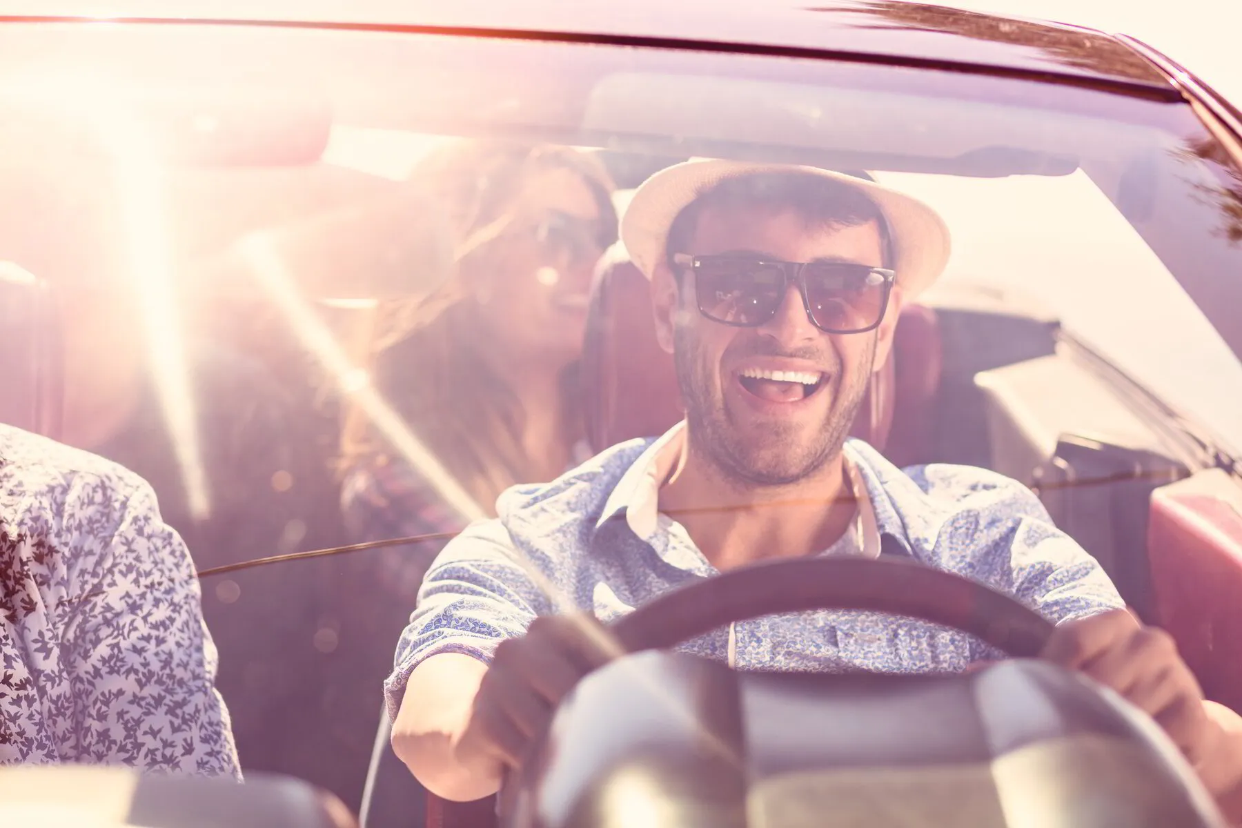 HAPPY FRIENDS DRIVING A CLEAN CAR