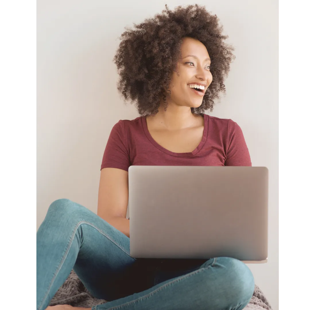 Smiling woman using computer