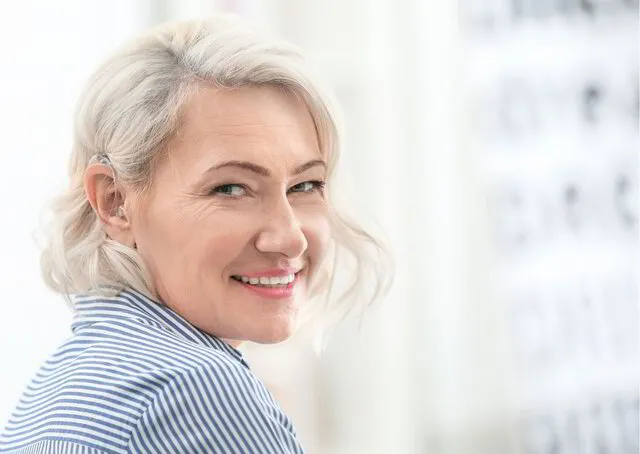 Lady smiling wearing Hearing Aids - Hearing @ Loftus