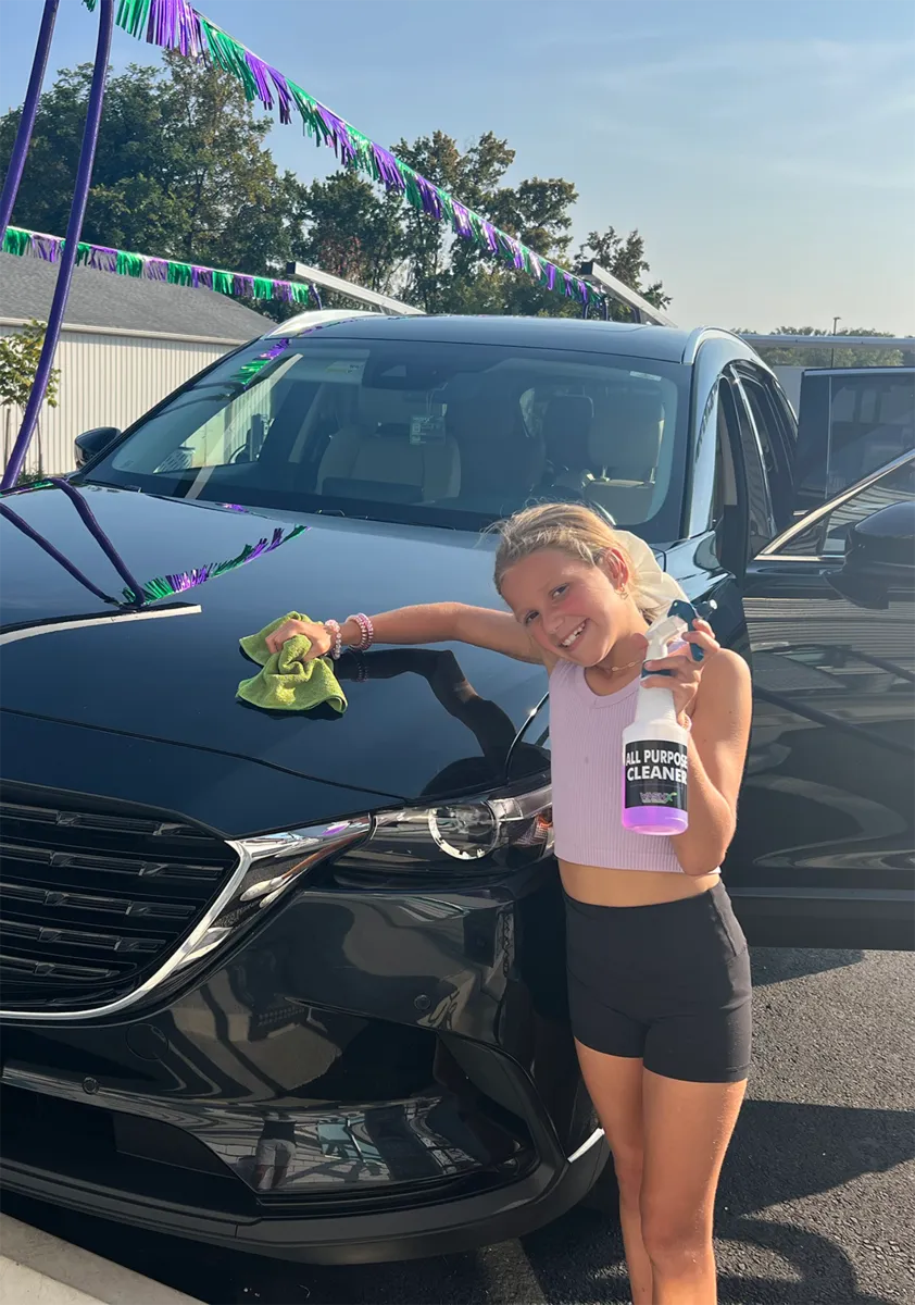 Girl Cleaning Car at WashX Car Wash