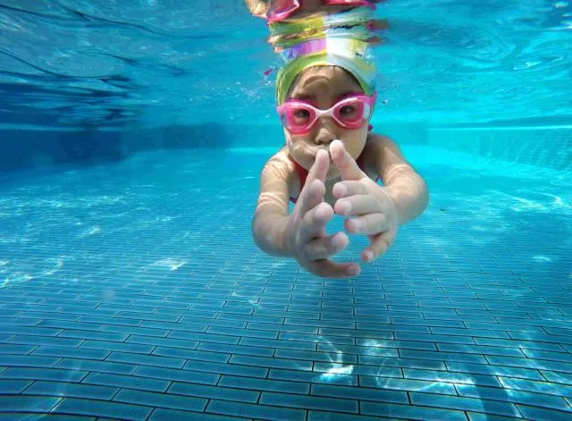 Kid swimming underwater