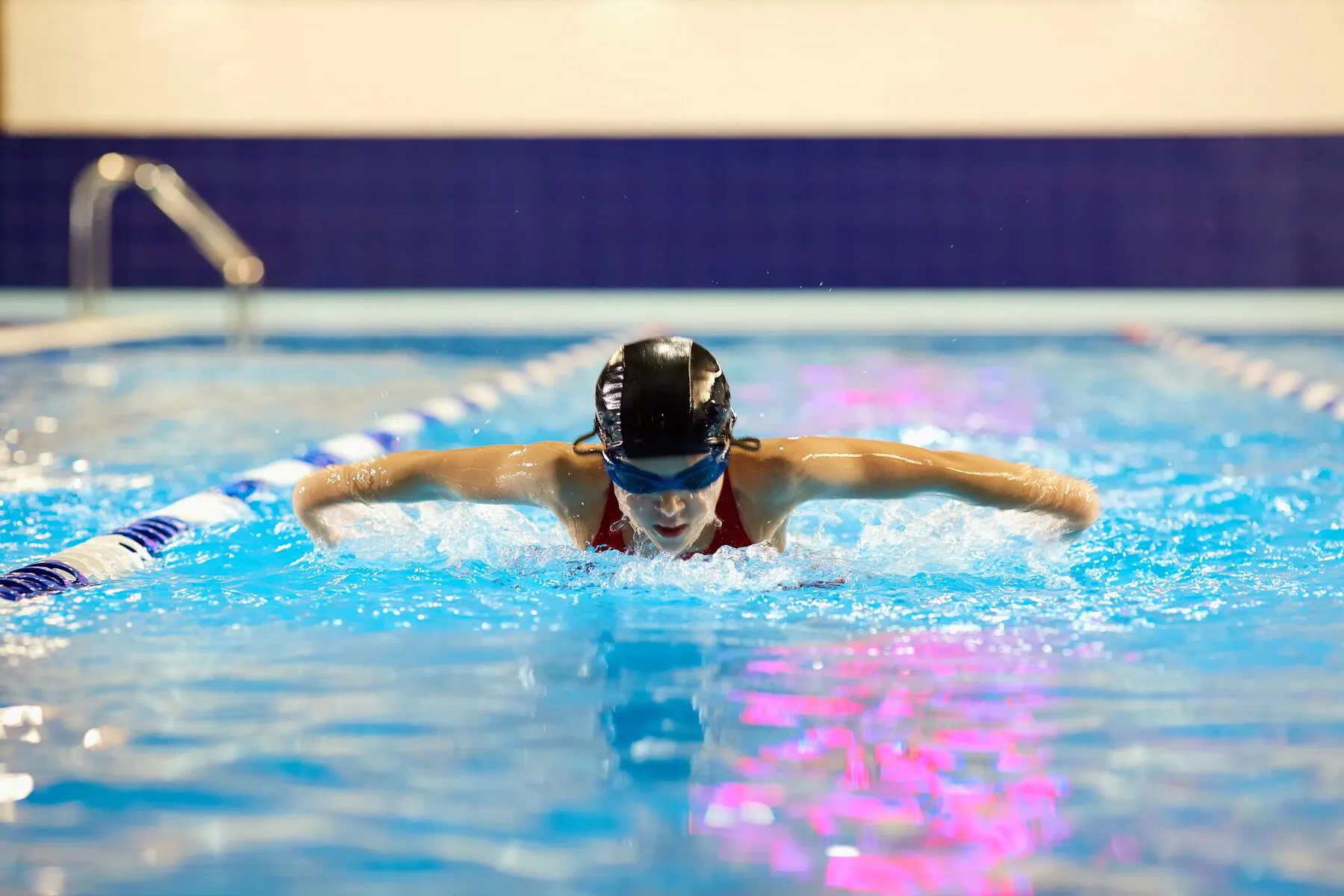 Butterfly stroke correction in a private swimming lesson