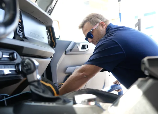 Trademark Car Wash Employee Wiping Down Bronco