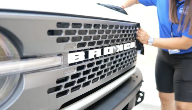 Trademark Car Wash Employee Wiping Down Bronco