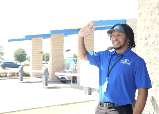 Trademark Car Wash Employee Waving Hello