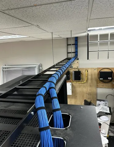 Surround sound speakers being installed in a home theater