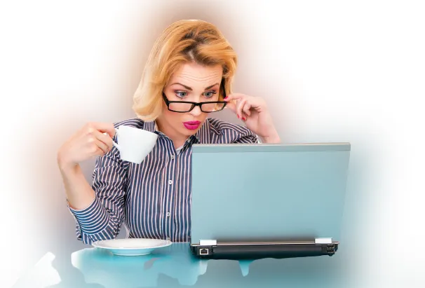 woman peaked interest on laptop and toolkit
