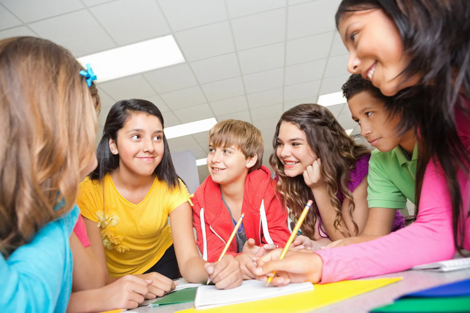 group of middle school children writing in class at Discovery Christian School. Effingham IL