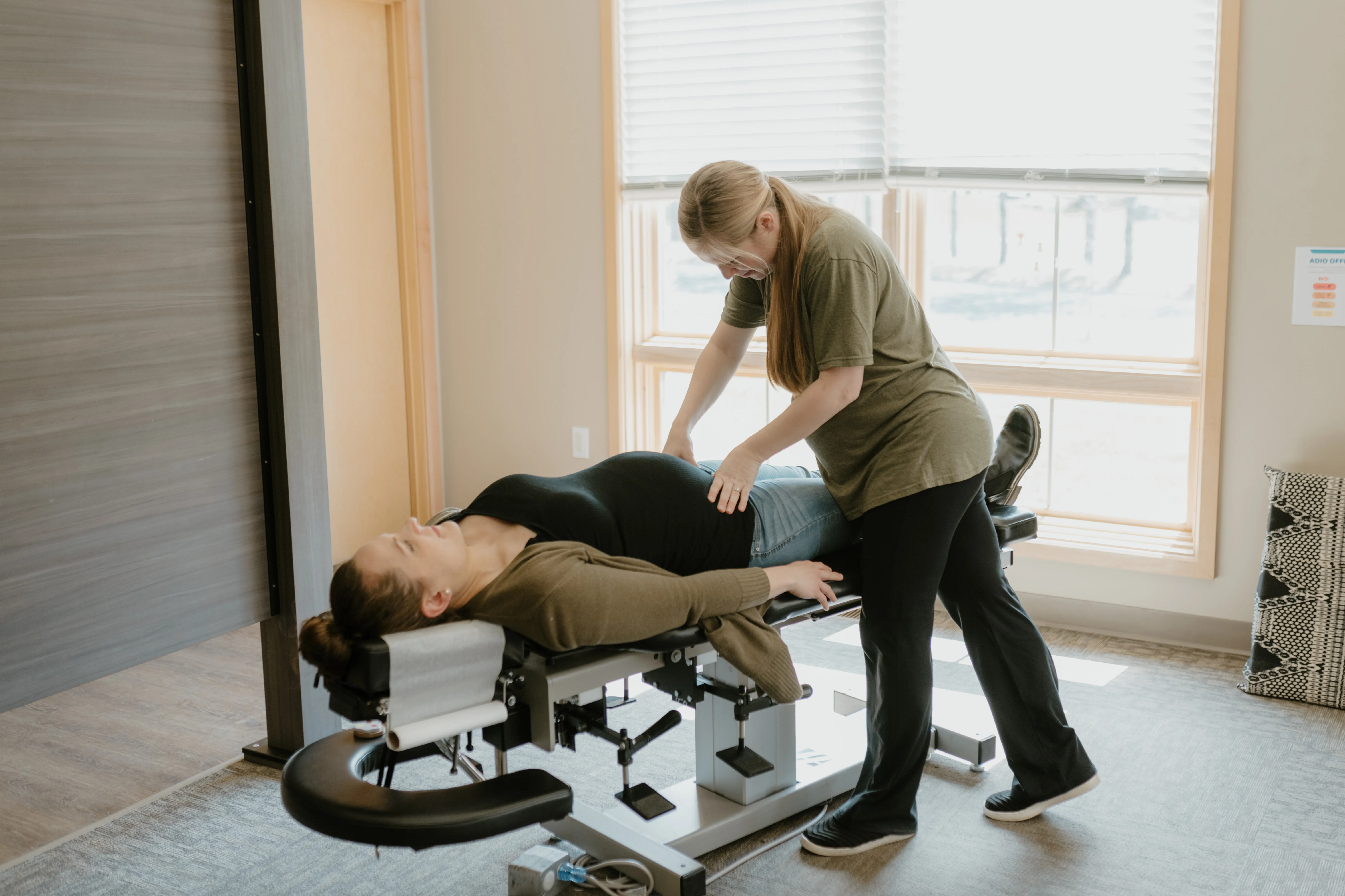 Pregnant patient receiving gentle chiropractic care