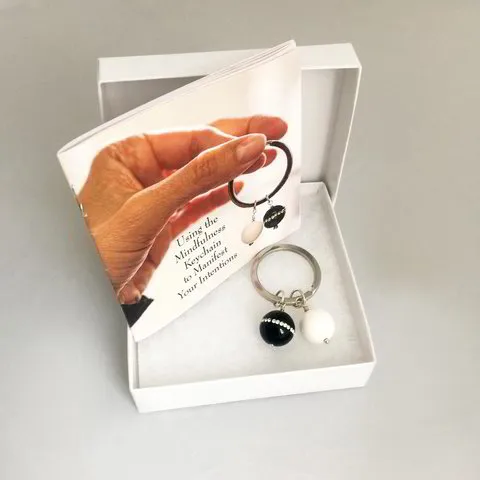 Kim Bellisimo's Mindfulness Keychain is a way to activate and manifest your intentions. This keychain allows you to clear your blocks as they come up in the moment and reset your space and move forward into your new reality. You will get a guide, a keychain and when you send me your email address you will receive a free audio.