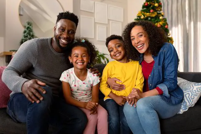 https://content.app-sources.com/s/25063289071576983/thumbnails/640x480/Images/happy-african-american-family-sitting-on-sofa-and-2022-01-19-00-02-22-utc_1-0472306.jpg?format=webp