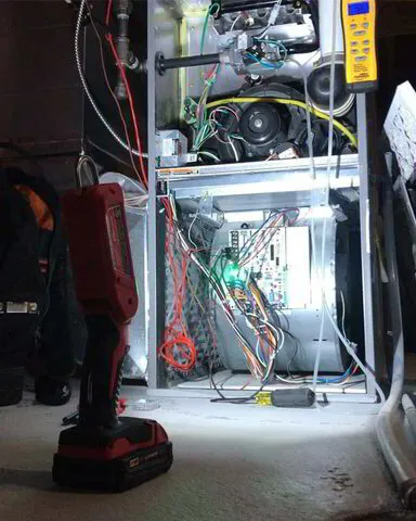 Furnace performance tune-up being performed