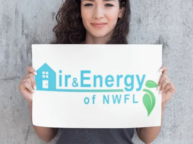Beautiful woman holding up a Air and Energy NWFL sign