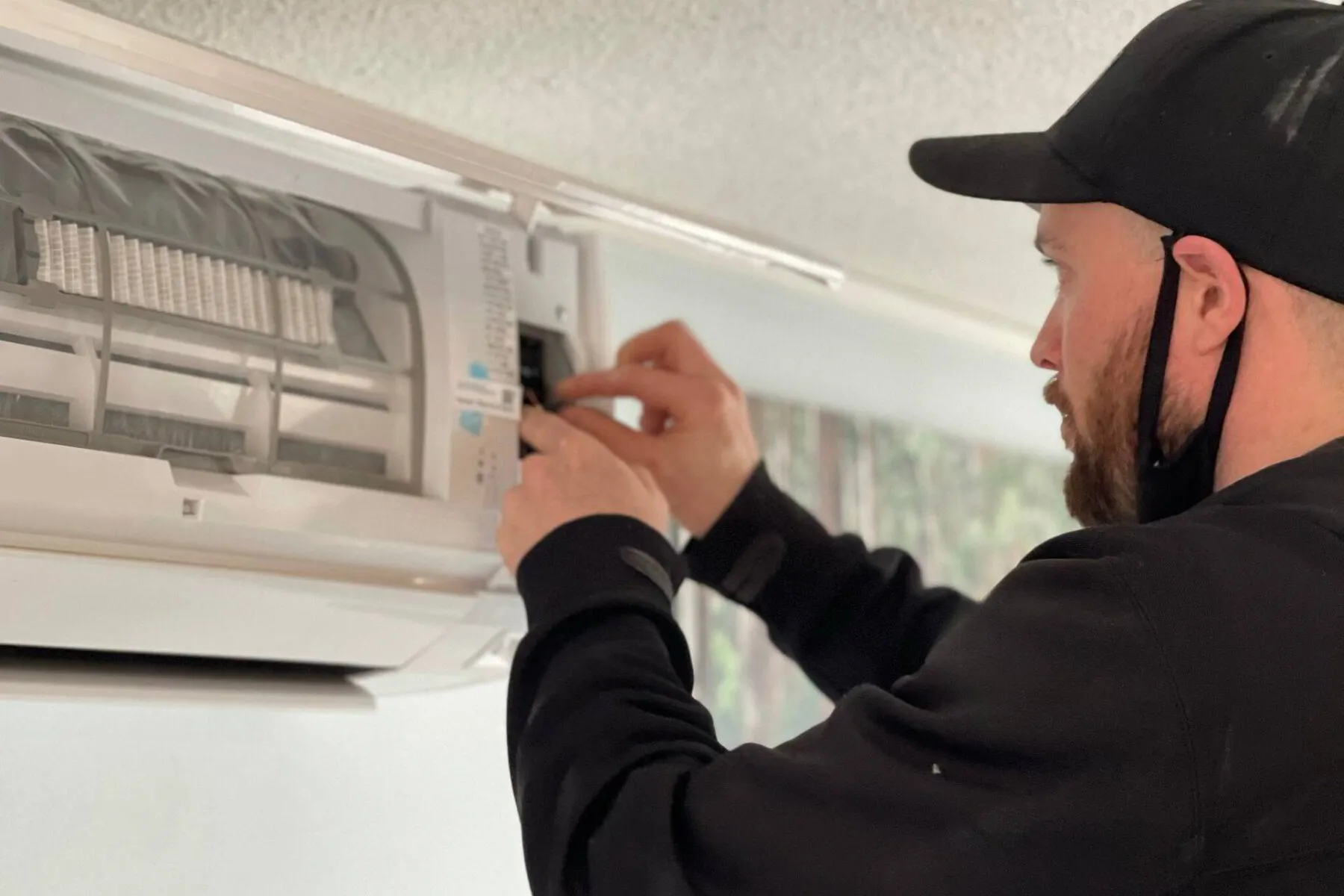 HVAC tech fixing mini split