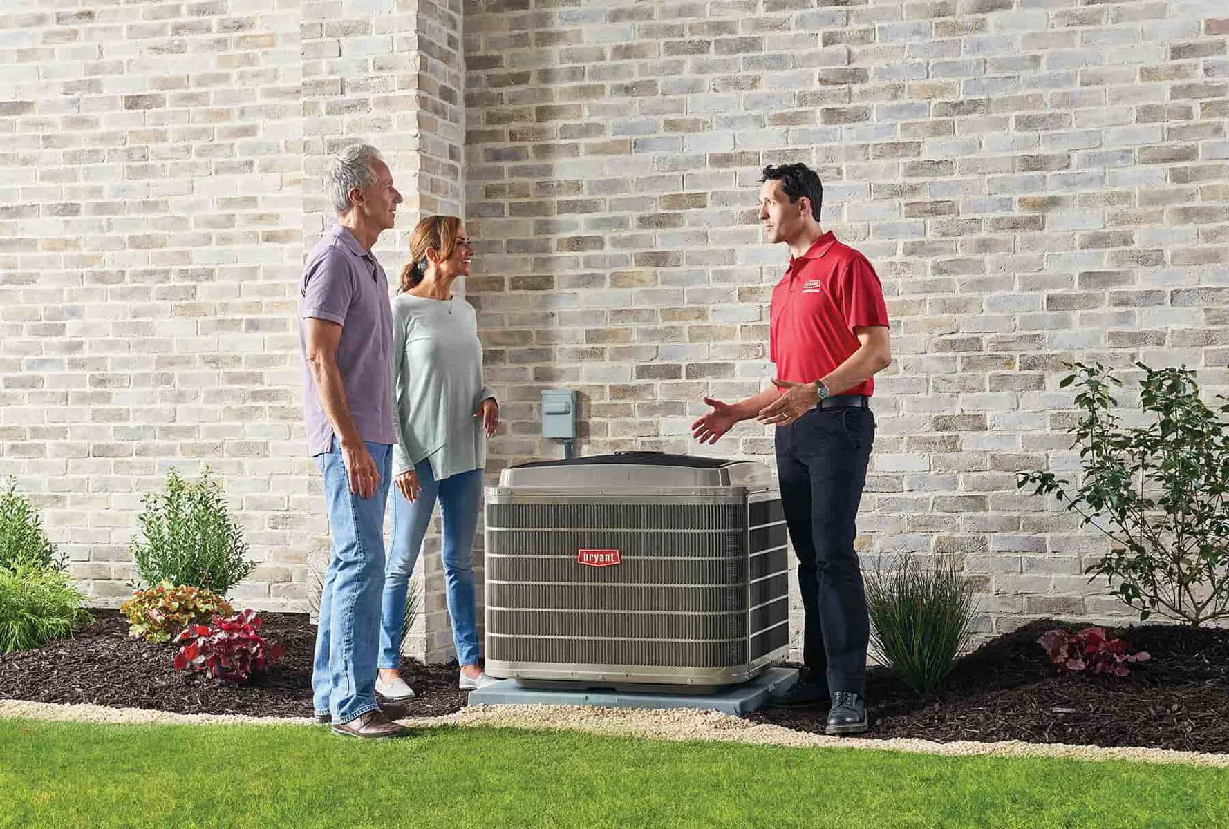 homeowners talking to a HVAC tech