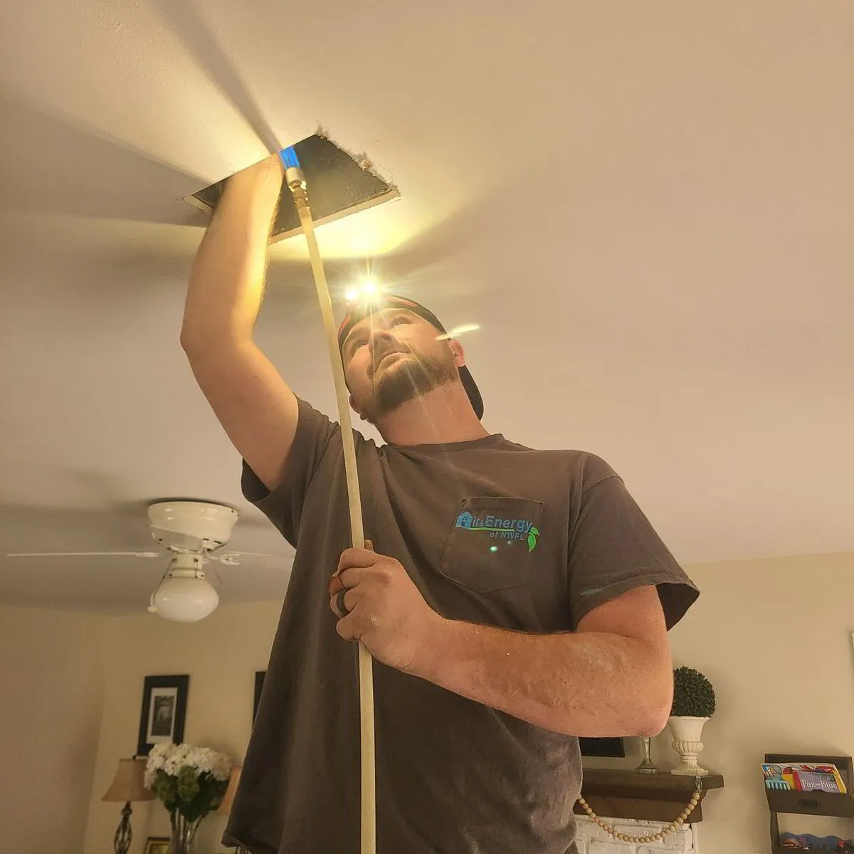 A duct cleaning specialist working in Pensacola