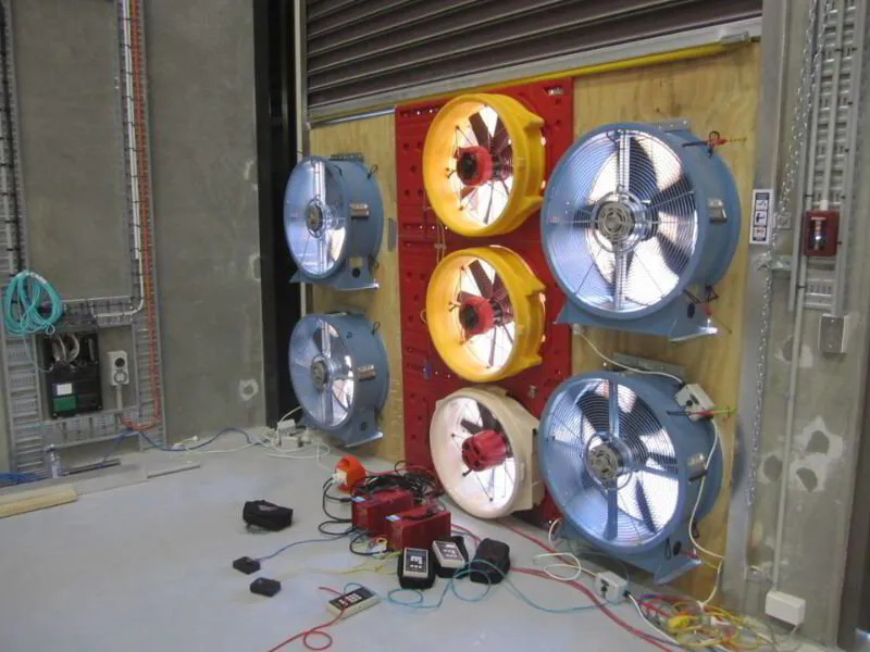 A bunch of blower fans testing air leakage on a large building