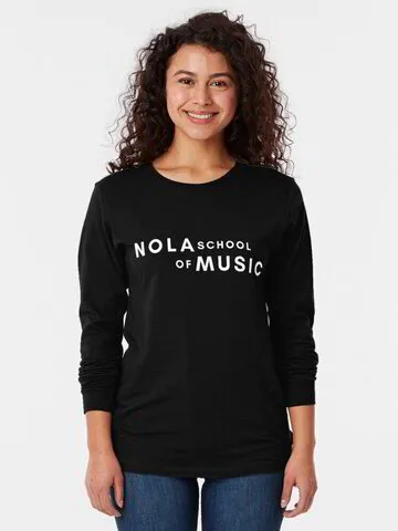 A woman wearing a long sleeved t-shirt with the NOLA School of Music logo