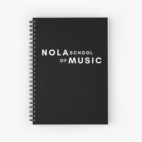 A black spiral bound notebook with the NOLA School of Music logo