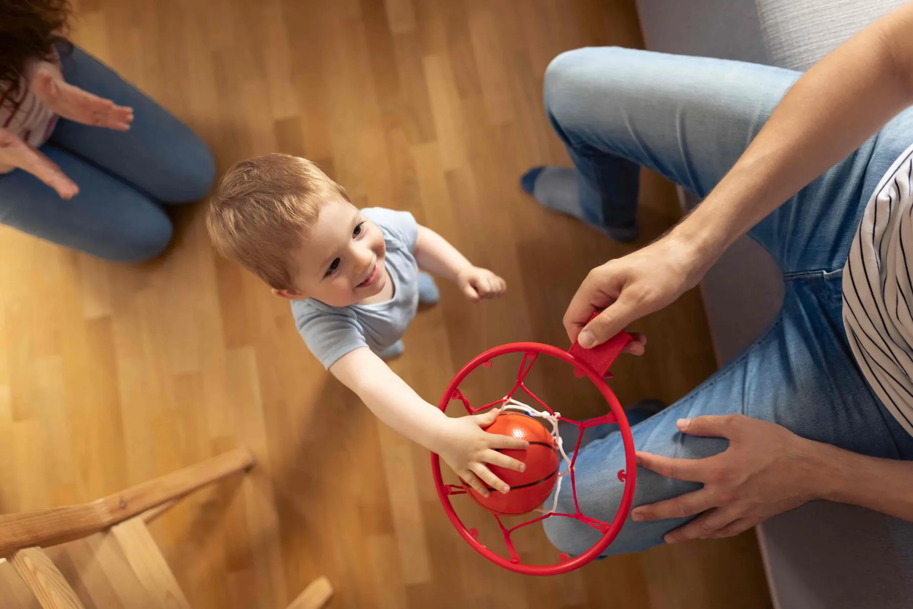 Happy toddler enjoy playing basketball - Toddler Motor Skill Development