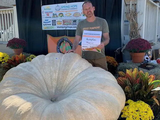 Kerry Gross, of Thomas, West Virginia with his 1661.5 Giant Pumpkin