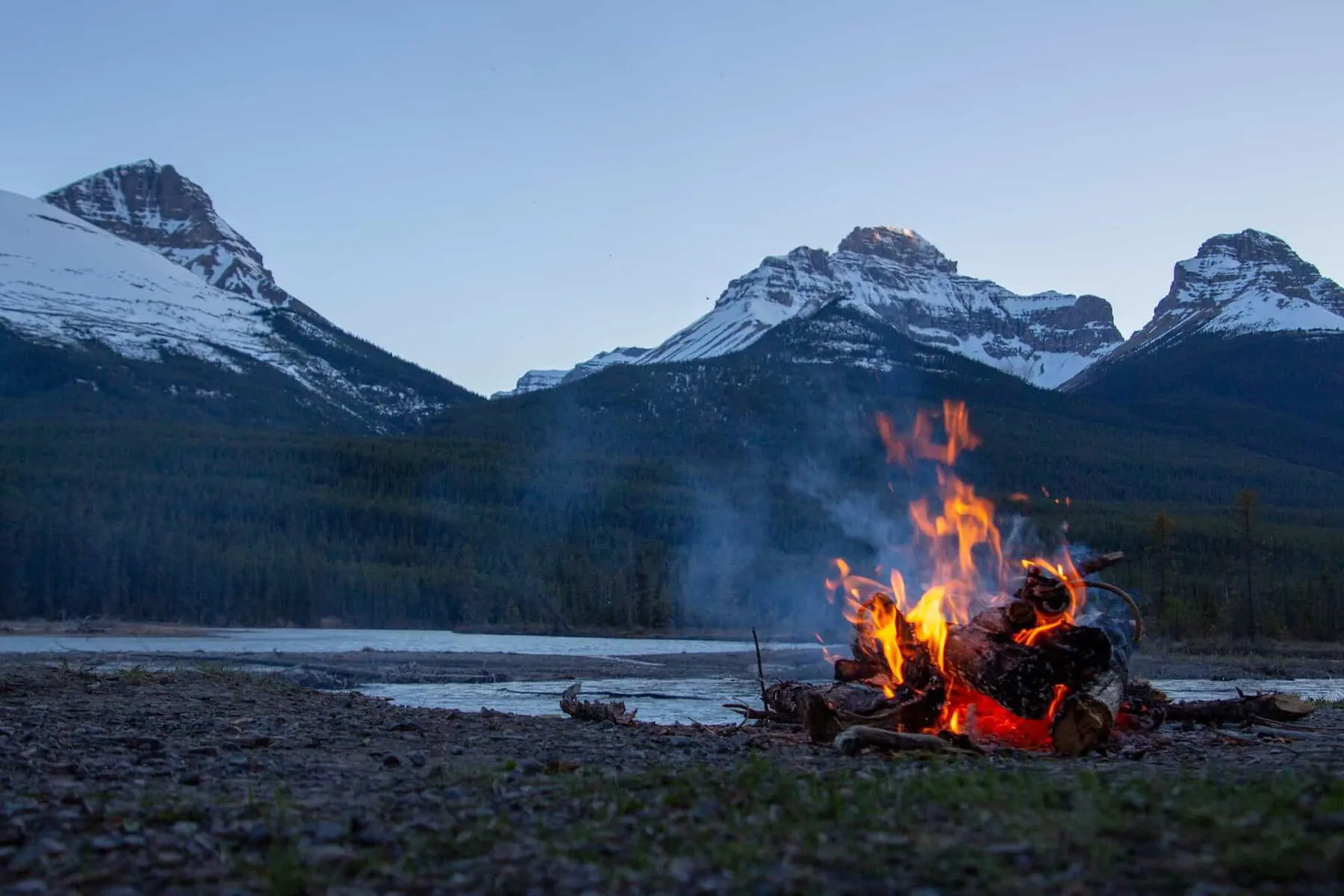 Campfire with mountains in the background