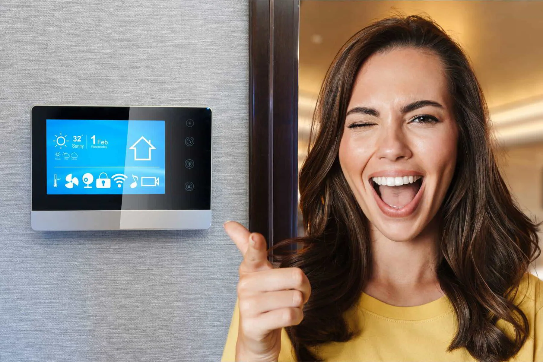 happy woman in front of a smart thermostat