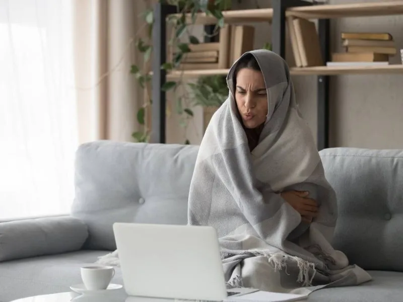 woman cold in living room