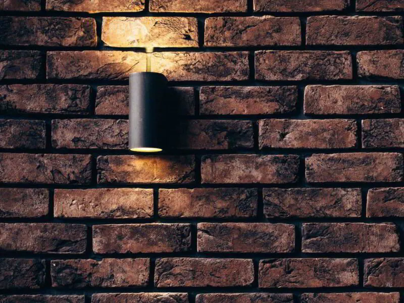 up lighting on brick wall