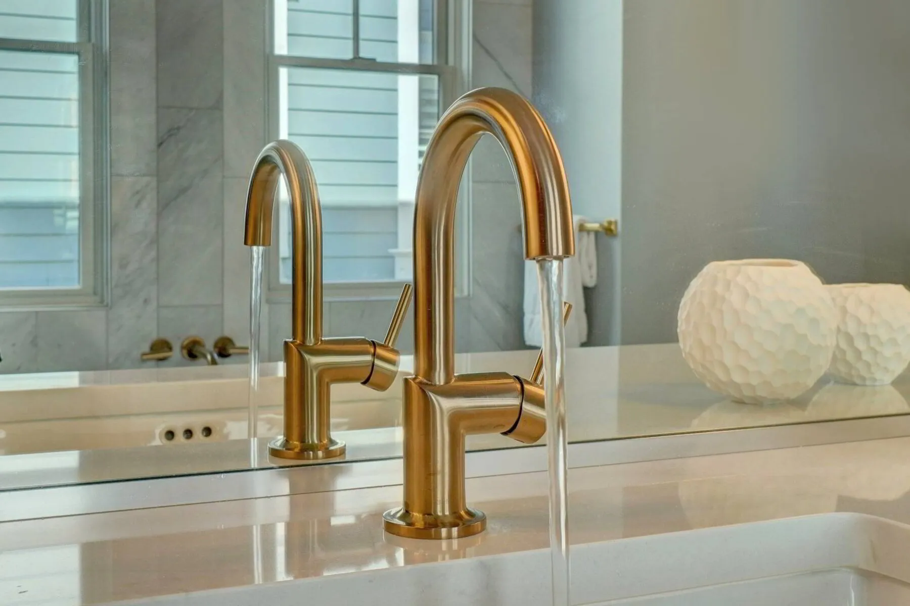 Copper finished faucet in a modern bathroom
