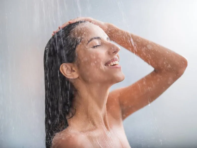 woman enjoying a hot shower