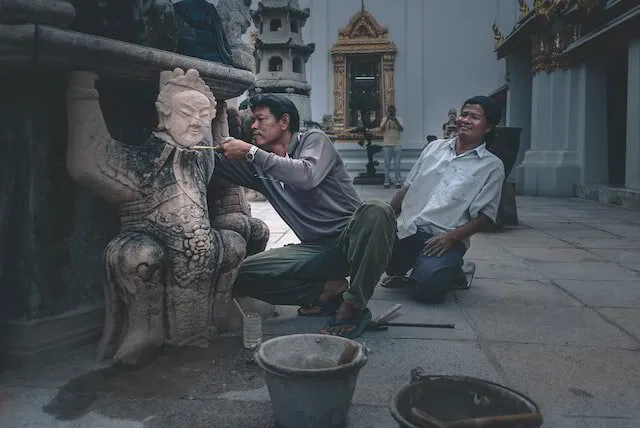 Man restoring a statue