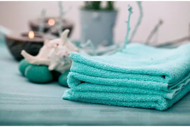 blue towels next to candles