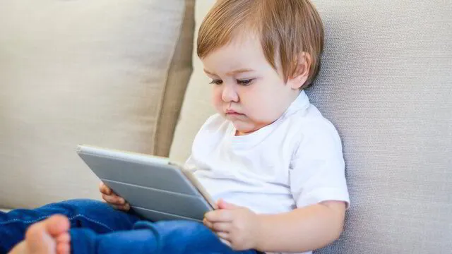 baby-boy-reading-from-tablet