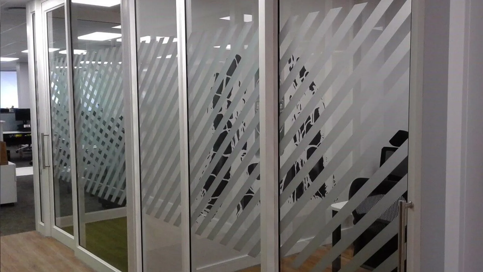 Sandblast striped applied to shopfront for privacy