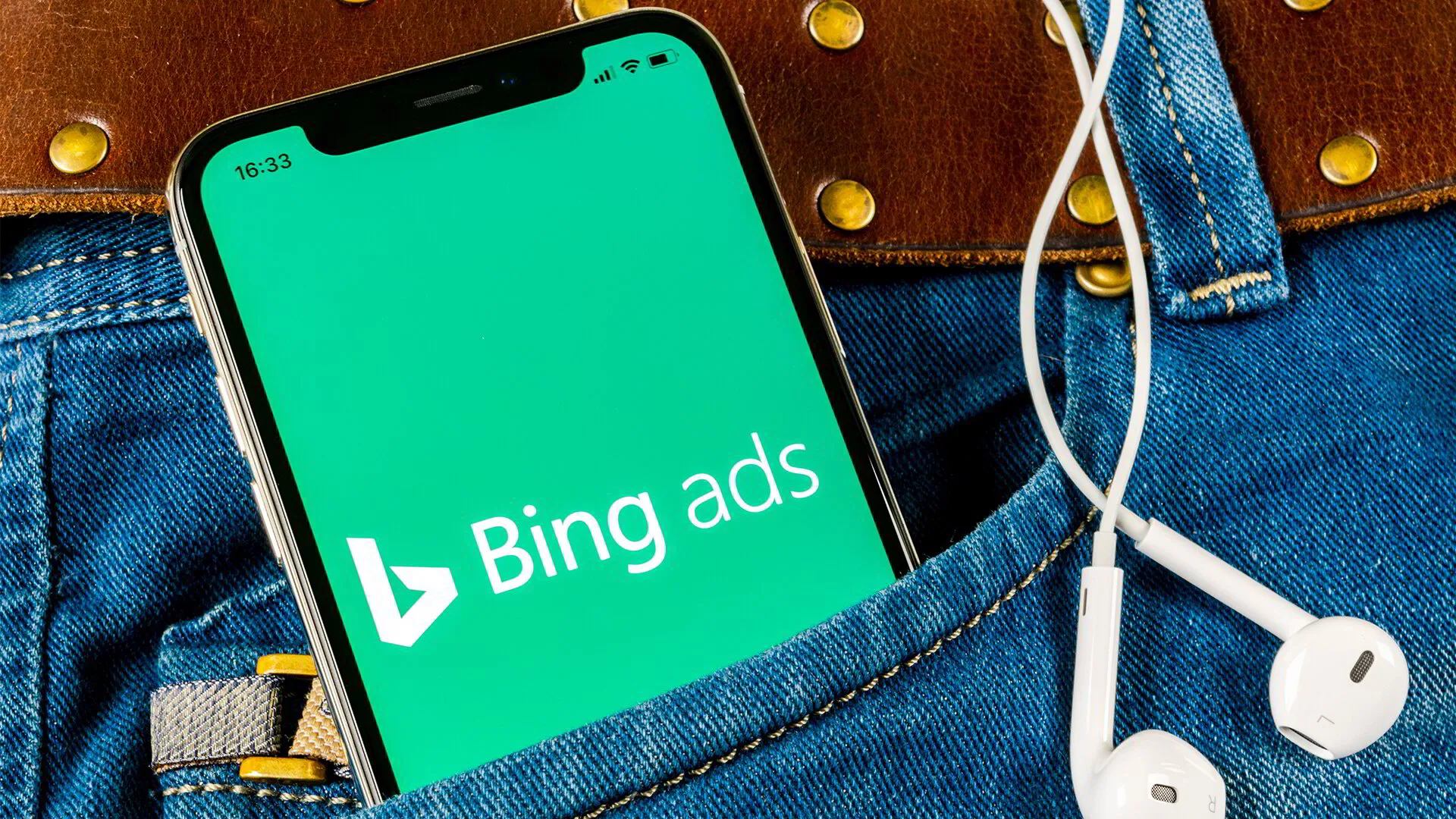 Mobile phone with Bing Ads on the screen in a jeans pocket