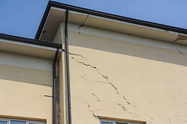 Water damage reconstruction contractor assessing structural damage in a Chicagoland home