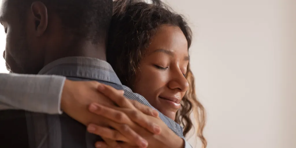 a man and woman hugging