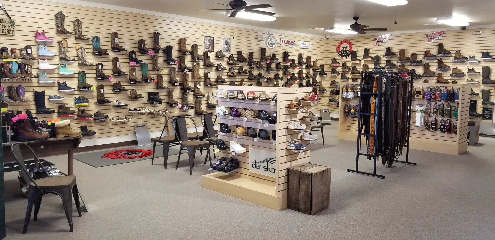 image of store wall with shoes all displayed