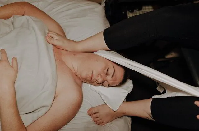 Owner performing deep tissue massage technique