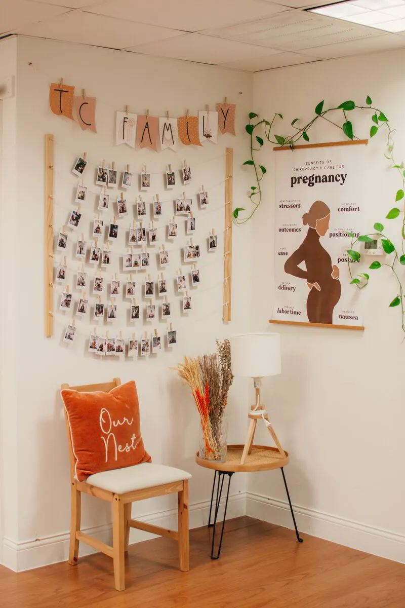 A welcoming corner of clinic displays a 'TC Family' photo wall, celebrating the community with a focus on prenatal care.