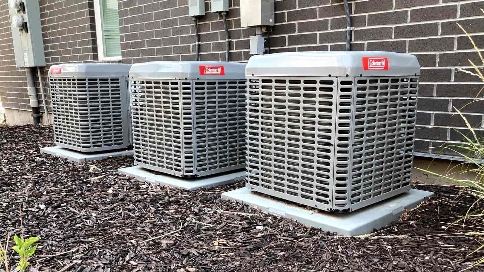 3 outdoor condensing ac units in a row