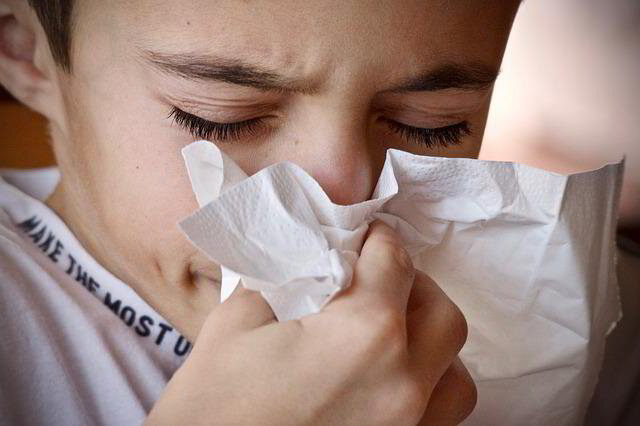 boy with allergies due to bad indoor air quality