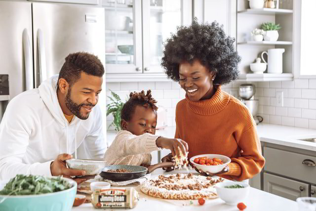 Happy family making a pizza