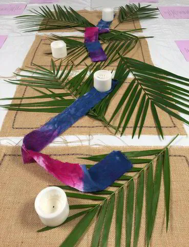 Palms with Candle and Blue and Pink Cloth