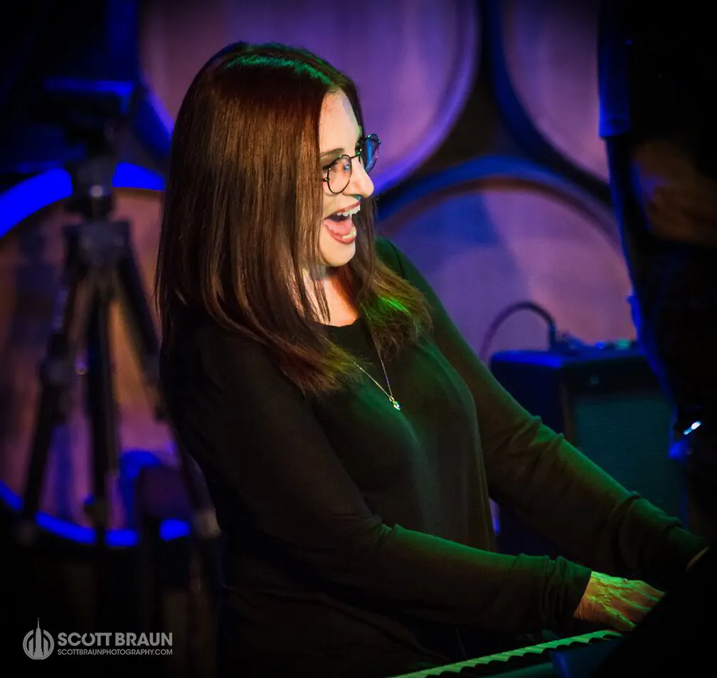 Elise Morris, renowned eclectic jazz artist and singer-songwriter, passionately performing live at the iconic City Winery venue in New York City, captivating the audience with her musical prowess.